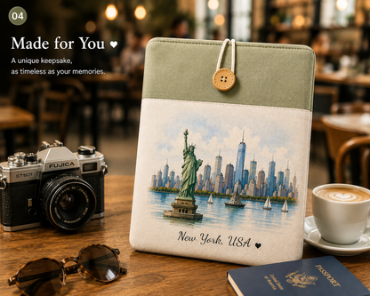Personalized travel laptop sleeve displayed in a cozy café setting